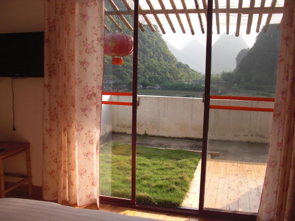 Huanggong Garden Hotel Yangshuo Rum bild